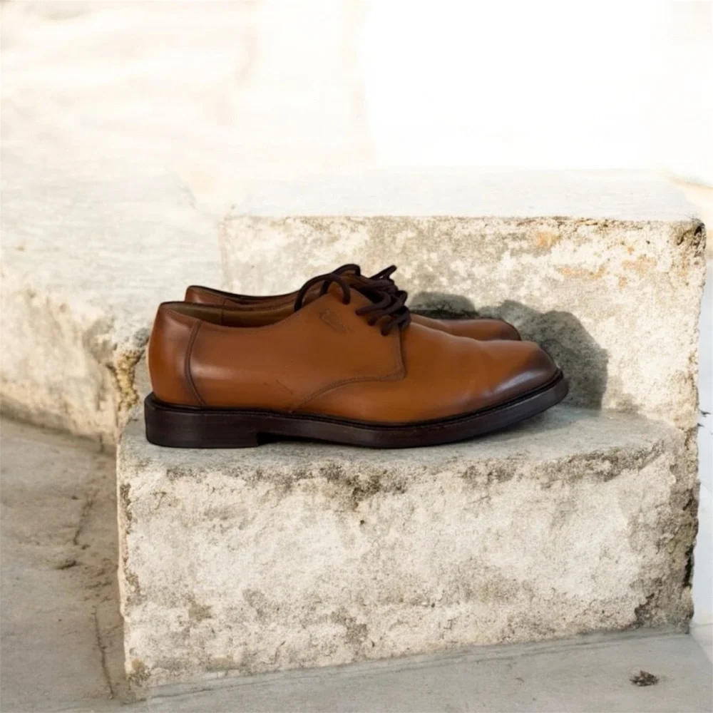 Gucci logo-debossed leather Derby shoes